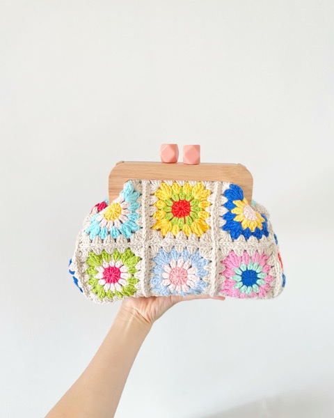Granny square crochet clutch in pastel colours